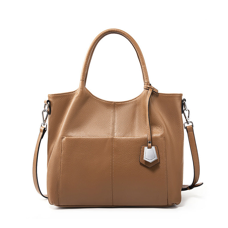 Malas de pele genuína para mulheres, novas malas de ombro simples para primavera/verão 2026, malas tote de grande capacidade feminina, malas para mães de meia-idade, malas crossbody