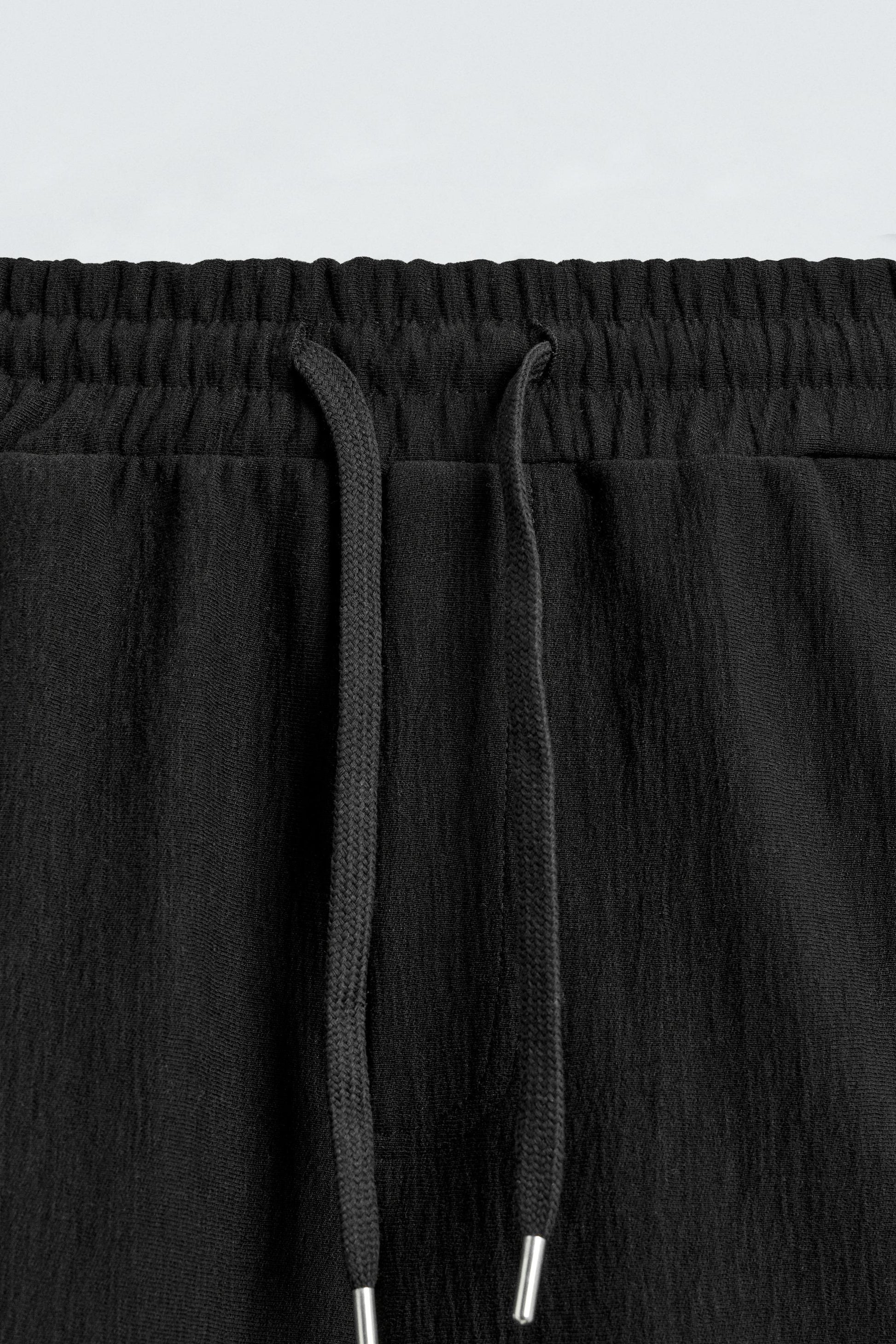 CALÇÕES BERMUDA JOGGER COM ESTRUTURA
