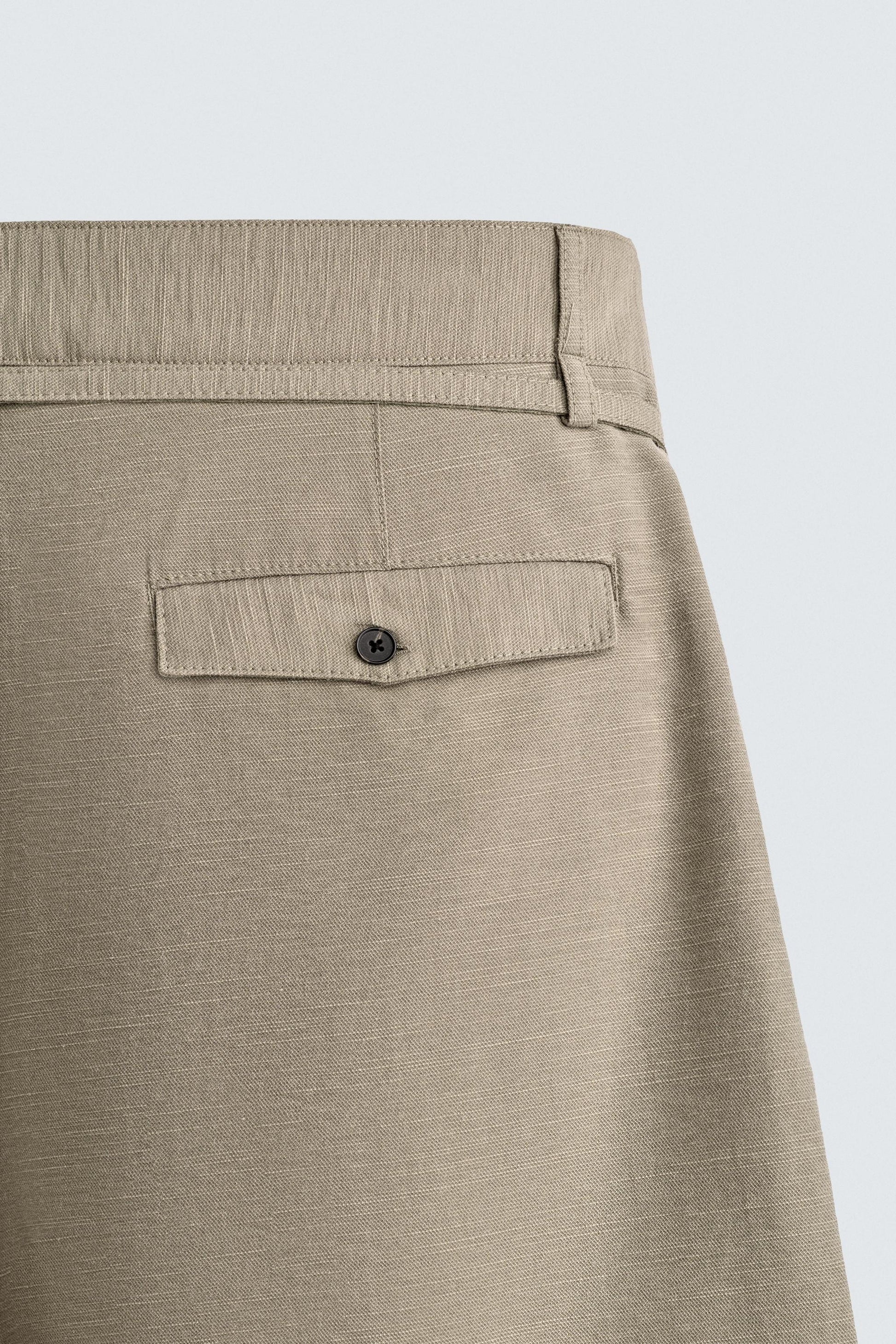 CALÇÕES BERMUDA RELAXED FIT COM PREGAS E CINTO