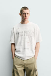 T-SHIRT DE MALHA ESTAMPADA COM LAVAGEM