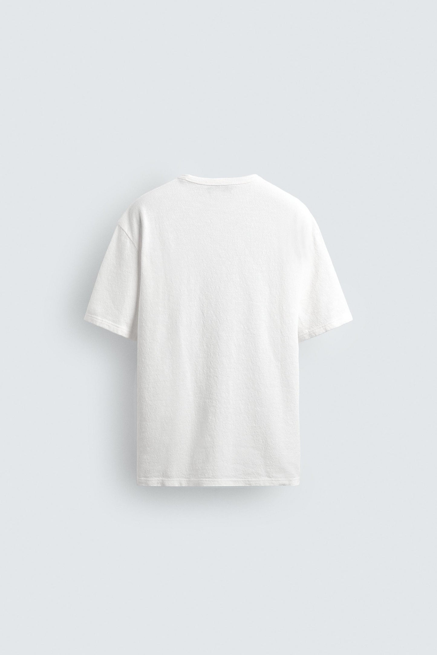 T-SHIRT DE MALHA ESTAMPADA COM LAVAGEM