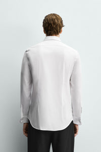CAMISA SLIM FIT PUNHO COM BOTÃO