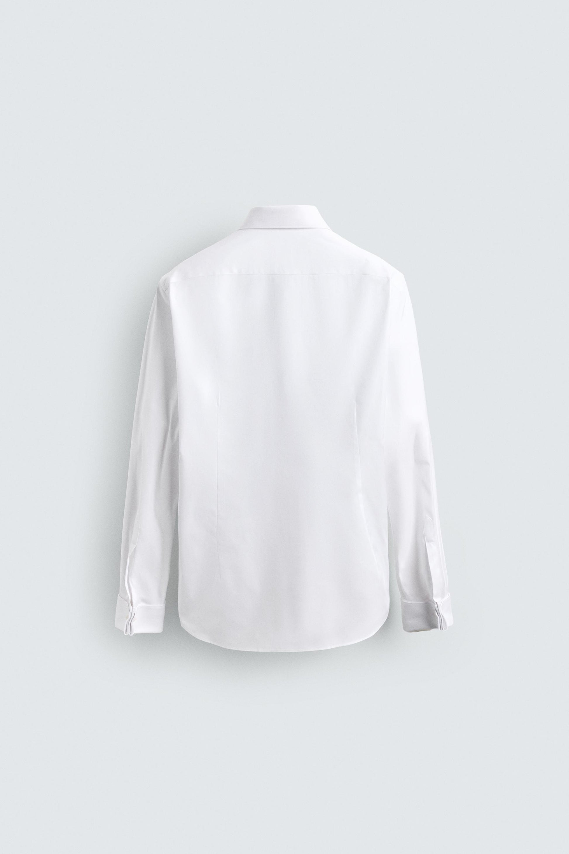 CAMISA SLIM FIT PUNHO COM BOTÃO