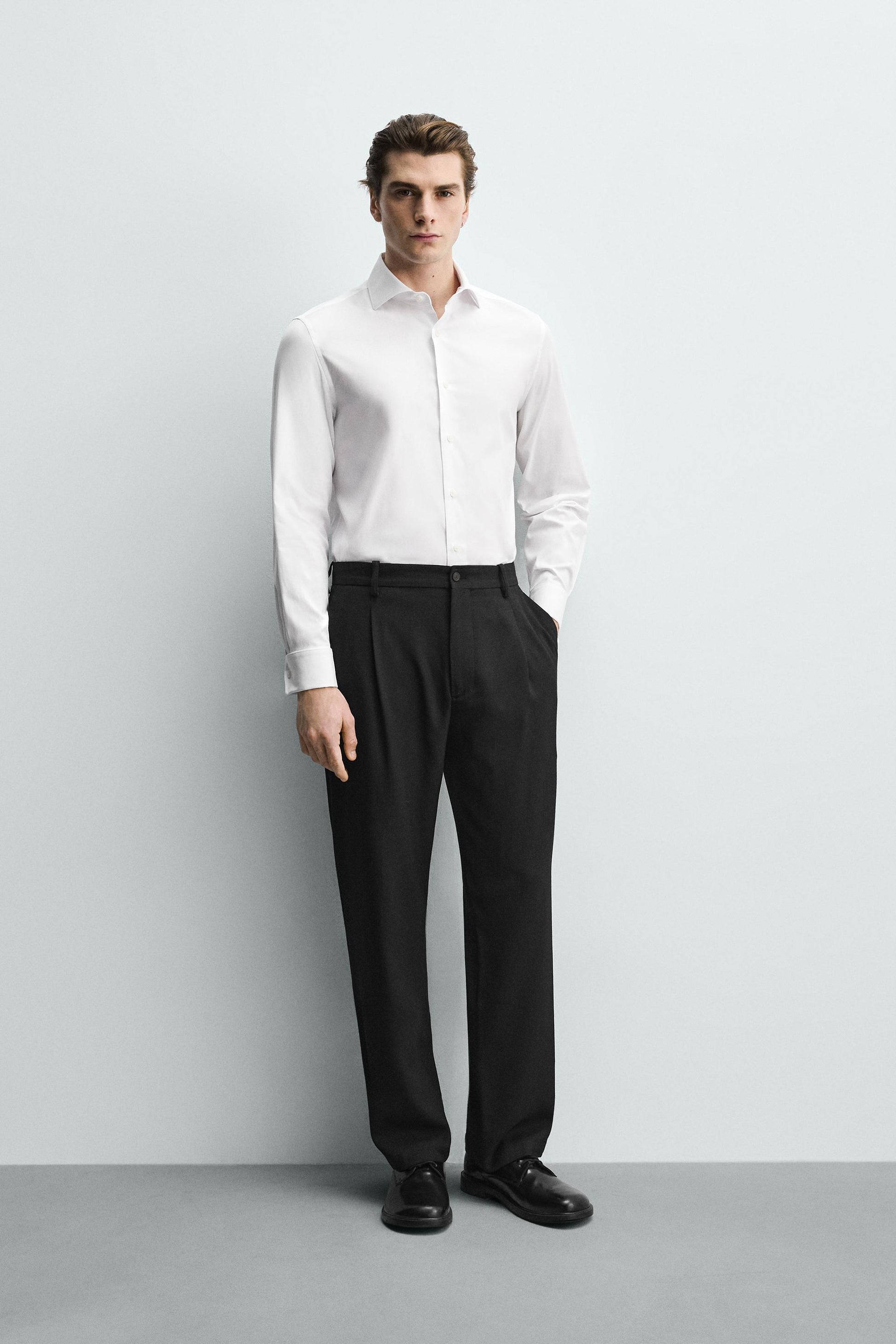 CAMISA SLIM FIT PUNHO COM BOTÃO