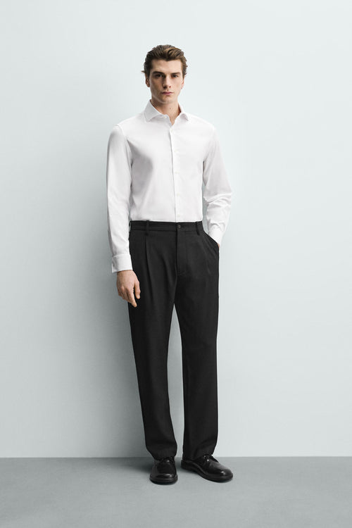 CAMISA SLIM FIT PUNHO COM BOTÃO
