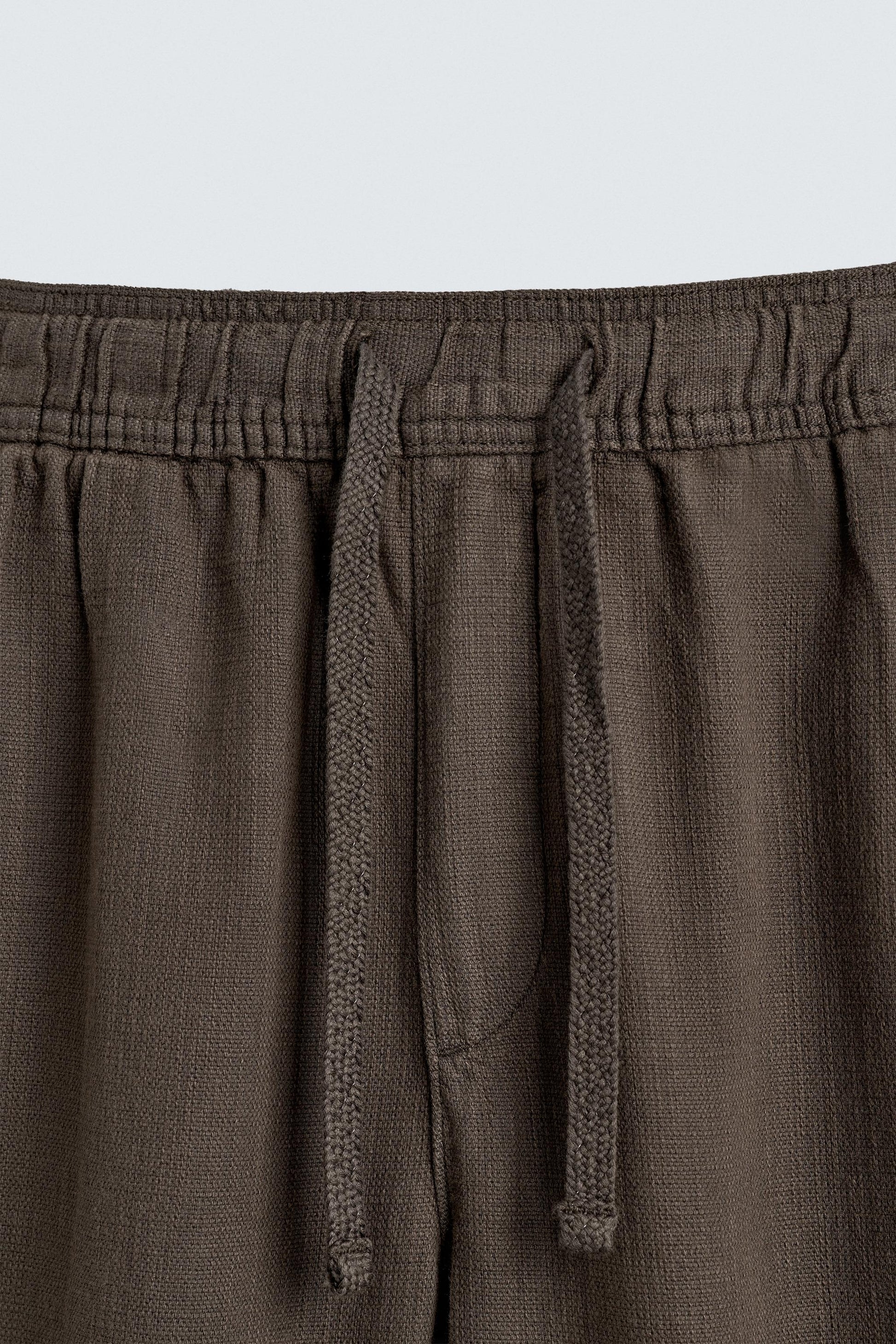 CALÇAS RELAXED FIT COM ESTRUTURA