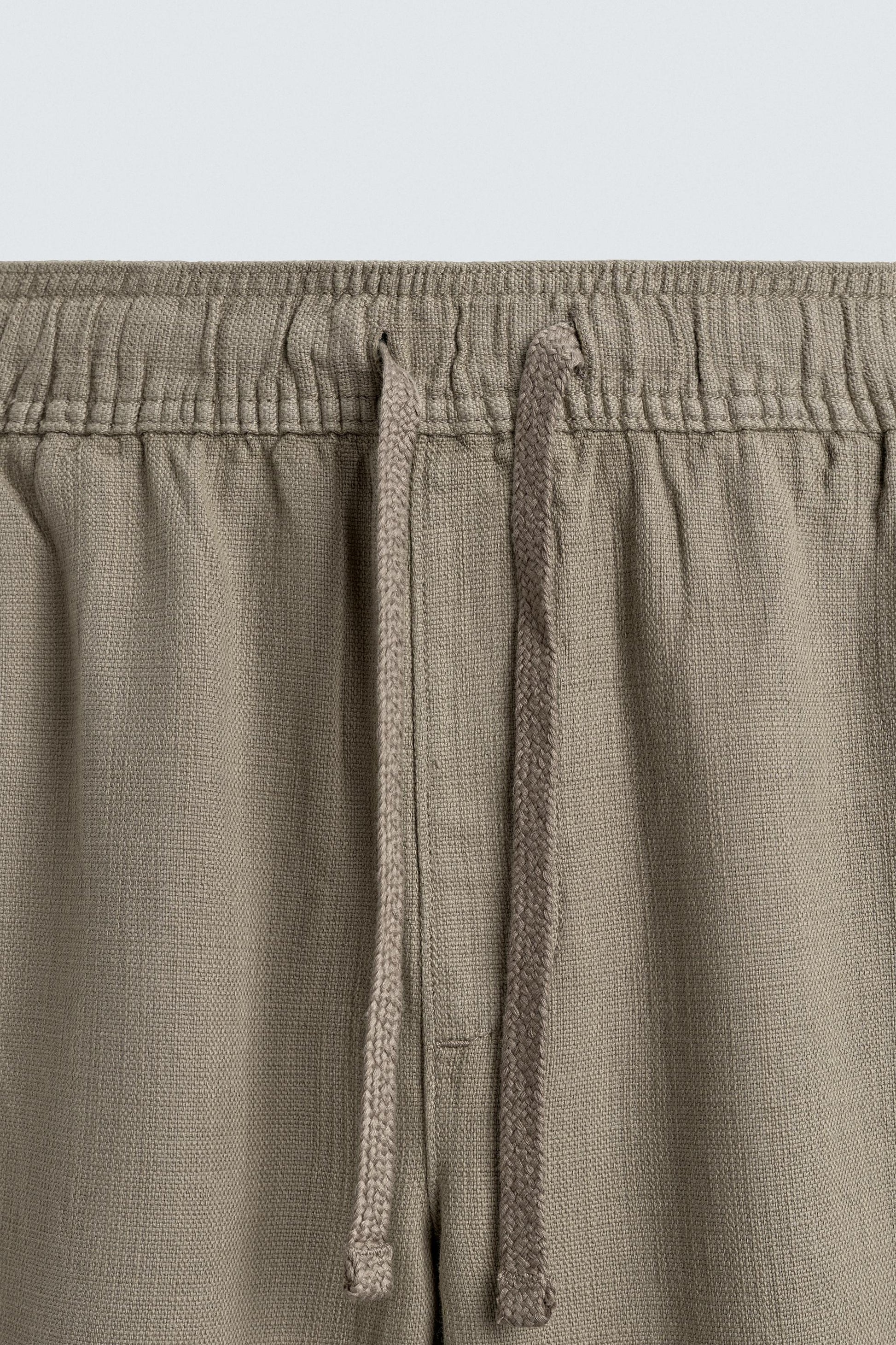 CALÇAS RELAXED FIT COM ESTRUTURA