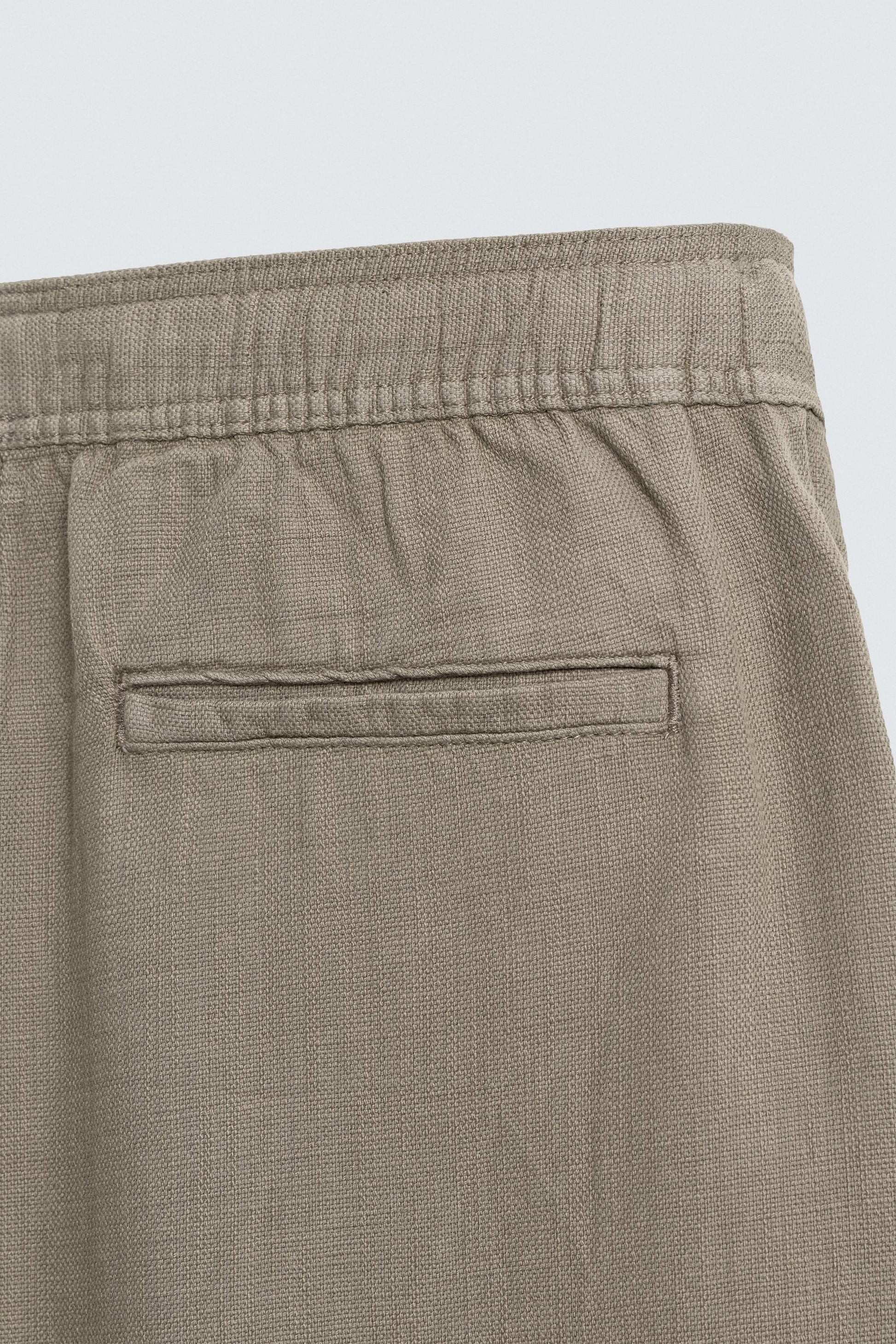 CALÇAS RELAXED FIT COM ESTRUTURA