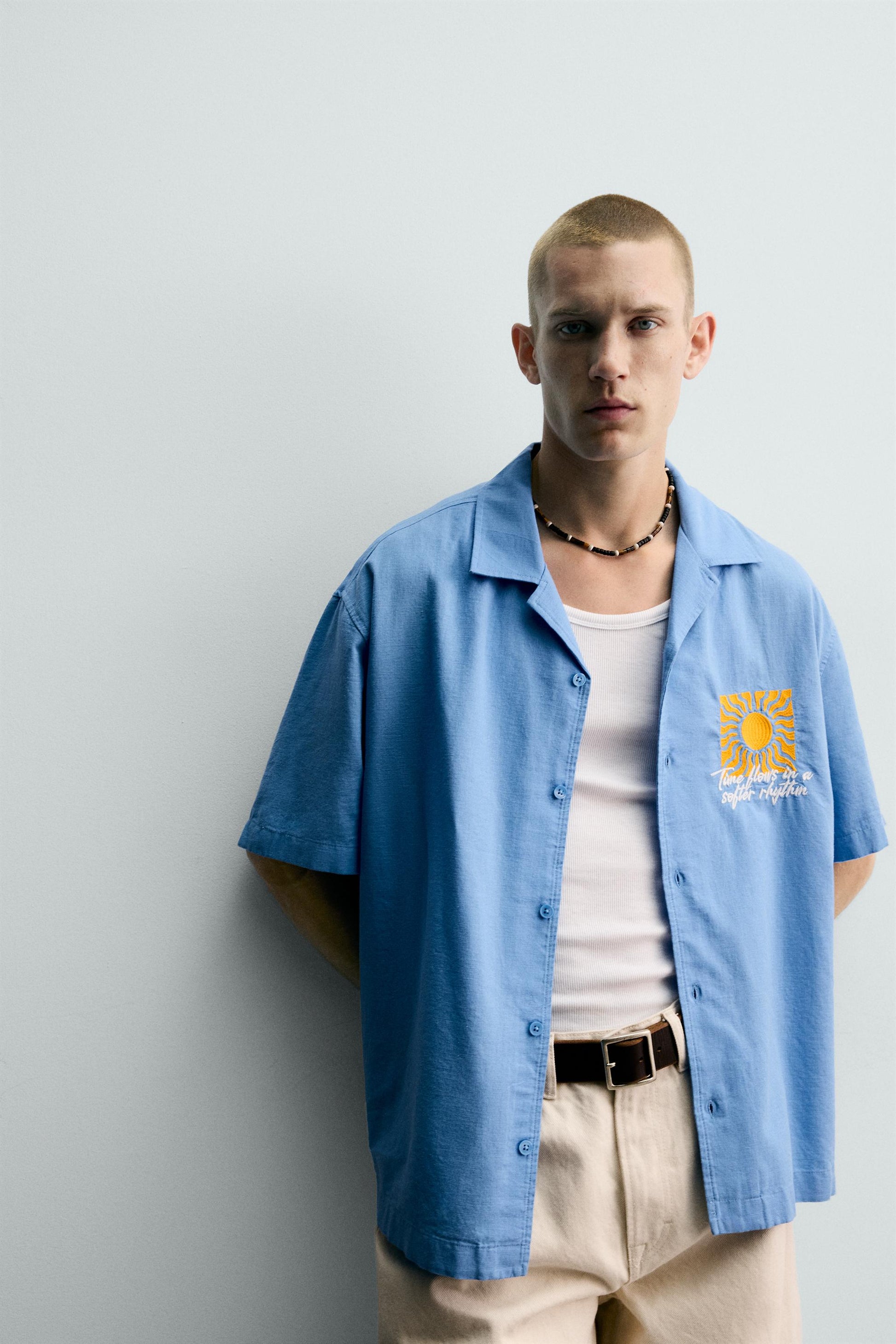 CAMISA RELAXED FIT COM BORDADO SOL