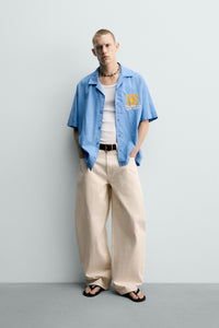 CAMISA RELAXED FIT COM BORDADO SOL