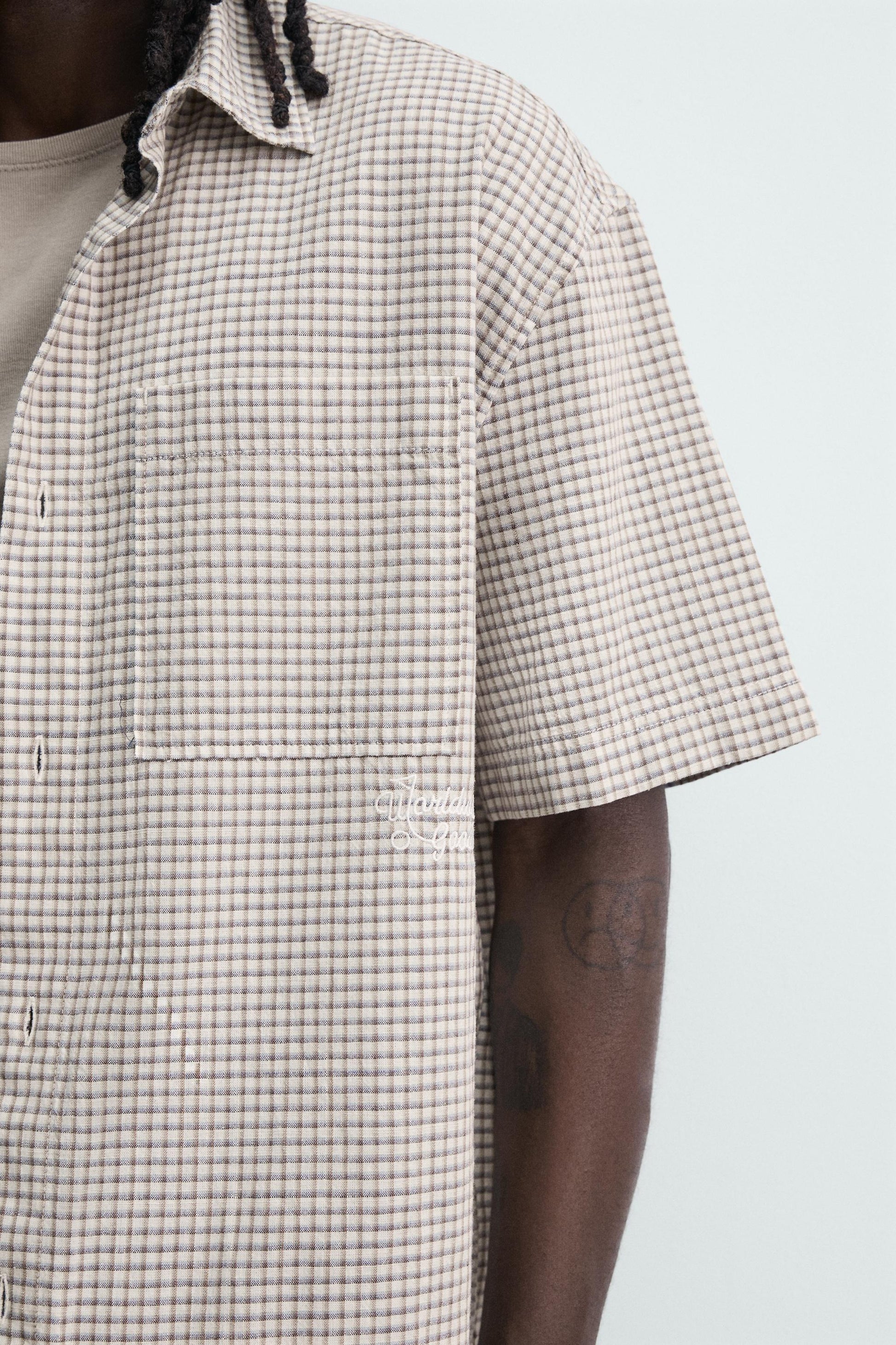 CAMISA RELAXED FIT XADREZ COM TEXTO