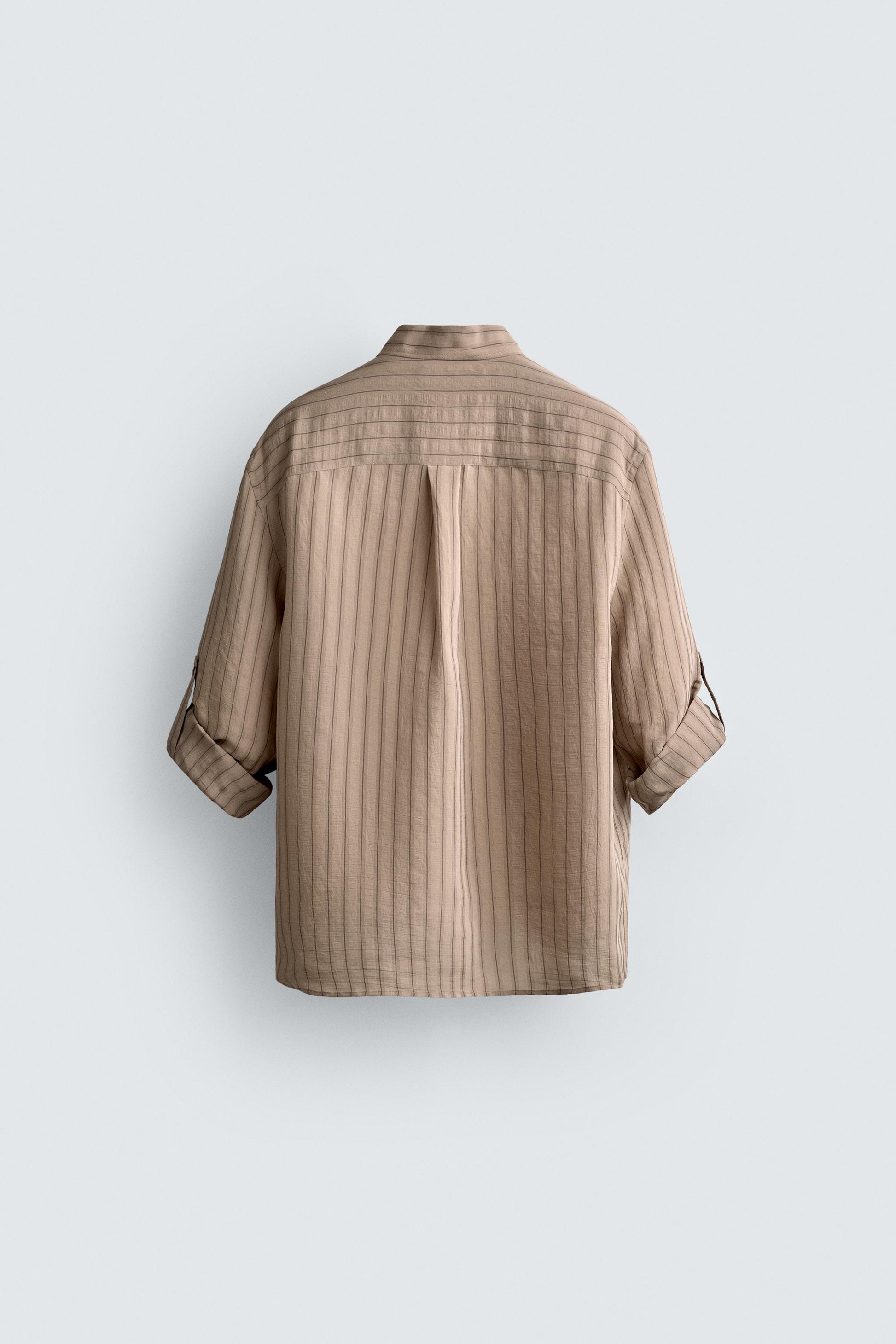 CAMISA ÀS RISCAS COM PRESILHA NA MANGA