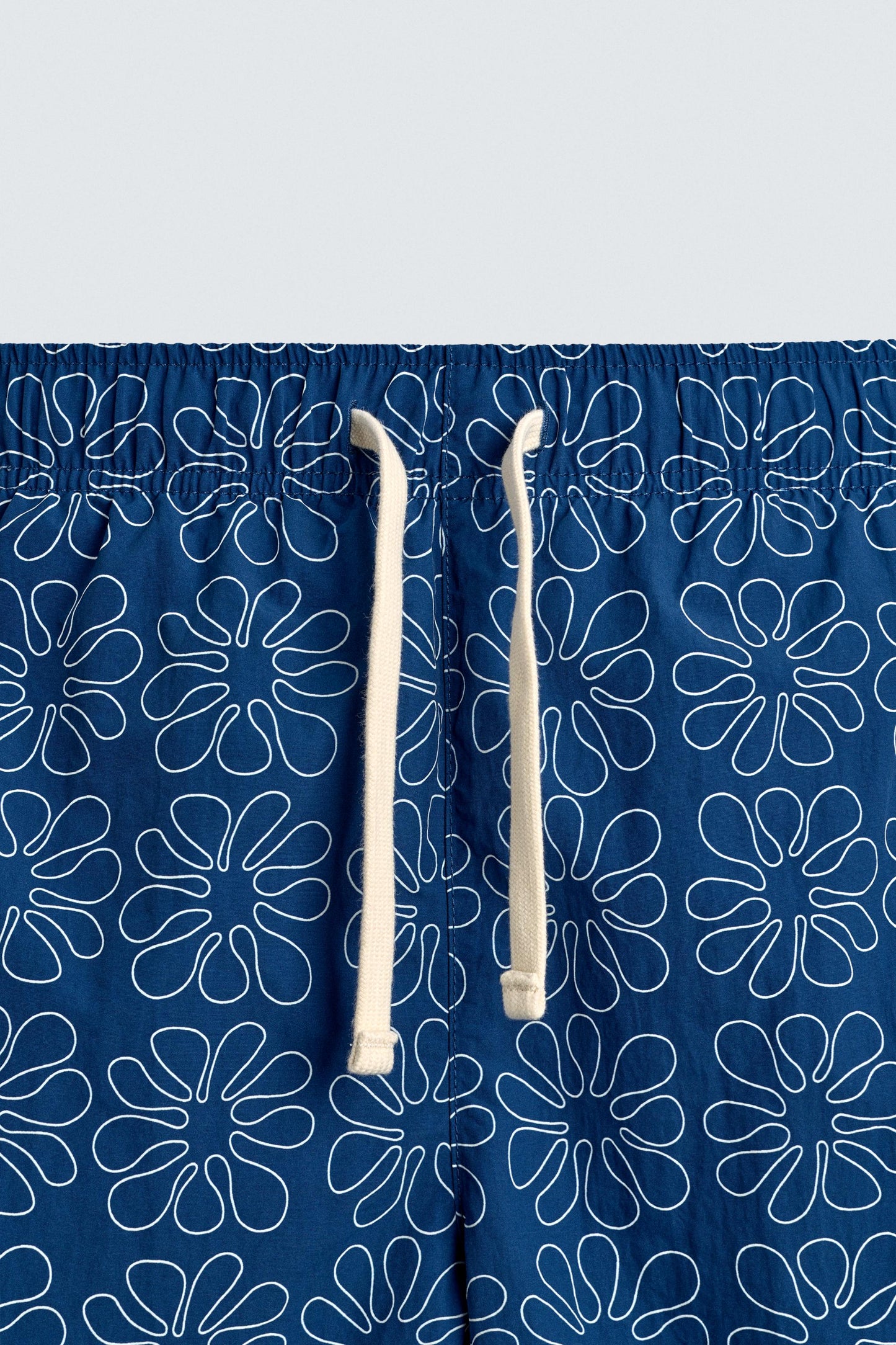 CALÇÕES DE BANHO COMPRIDOS COM ESTAMPADO FLORAL