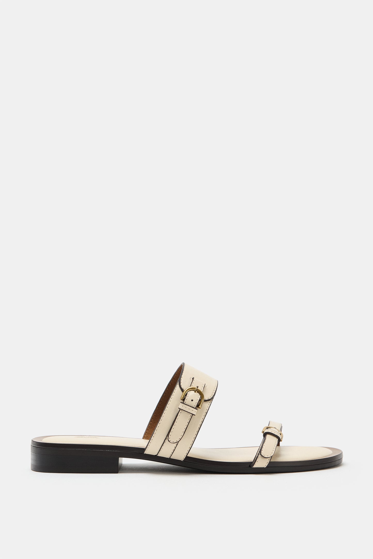 SANDÁLIA COM DETALHE DE FIVELAS - Branco-cru