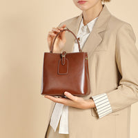Malas femininas, nova bolsa versátil primavera/verão 2025, mala crossbody de grande capacidade de alta gama, mala de ombro simples em pele genuína
