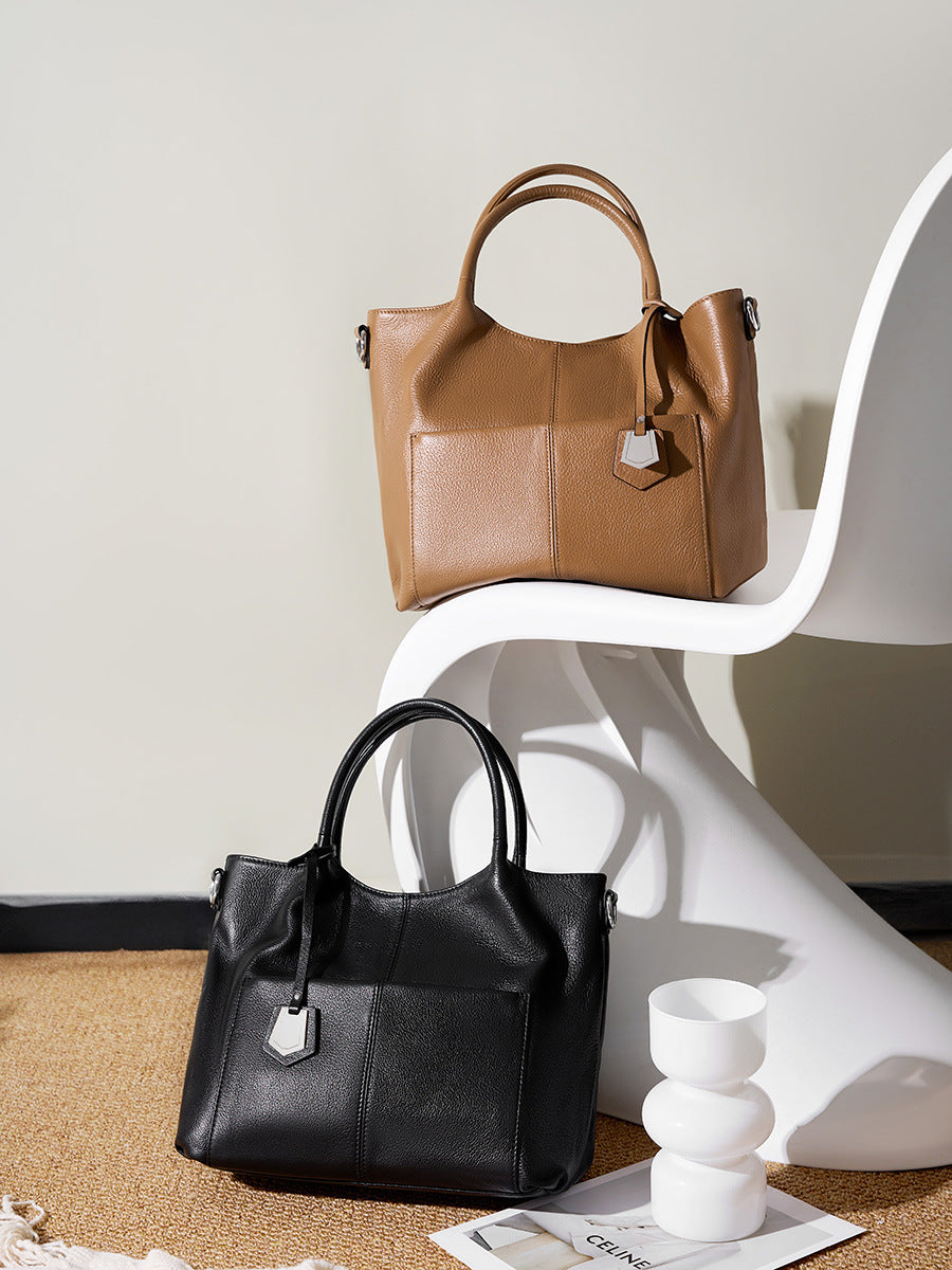 Malas de pele genuína para mulheres, novas malas de ombro simples para primavera/verão 2026, malas tote de grande capacidade feminina, malas para mães de meia-idade, malas crossbody