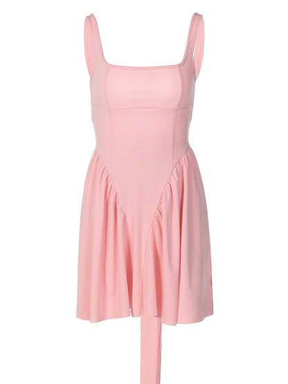 Verão transfronteiriço europeu e americano, novo vestido curto feminino feminino com alças sem costas, sexy de cor sólida e alças sem costas