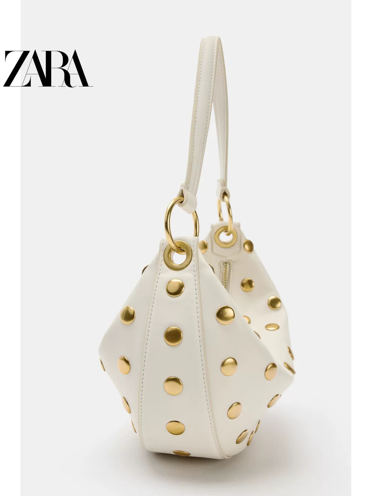 Bolsa feminina ZARA, lançamento da coleção verão 2026, com detalhes em rebites e zíper com argola metálica, modelo ombro, código 6094810 850.