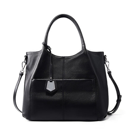 Malas de pele genuína para mulheres, novas malas de ombro simples para primavera/verão 2026, malas tote de grande capacidade feminina, malas para mães de meia-idade, malas crossbody