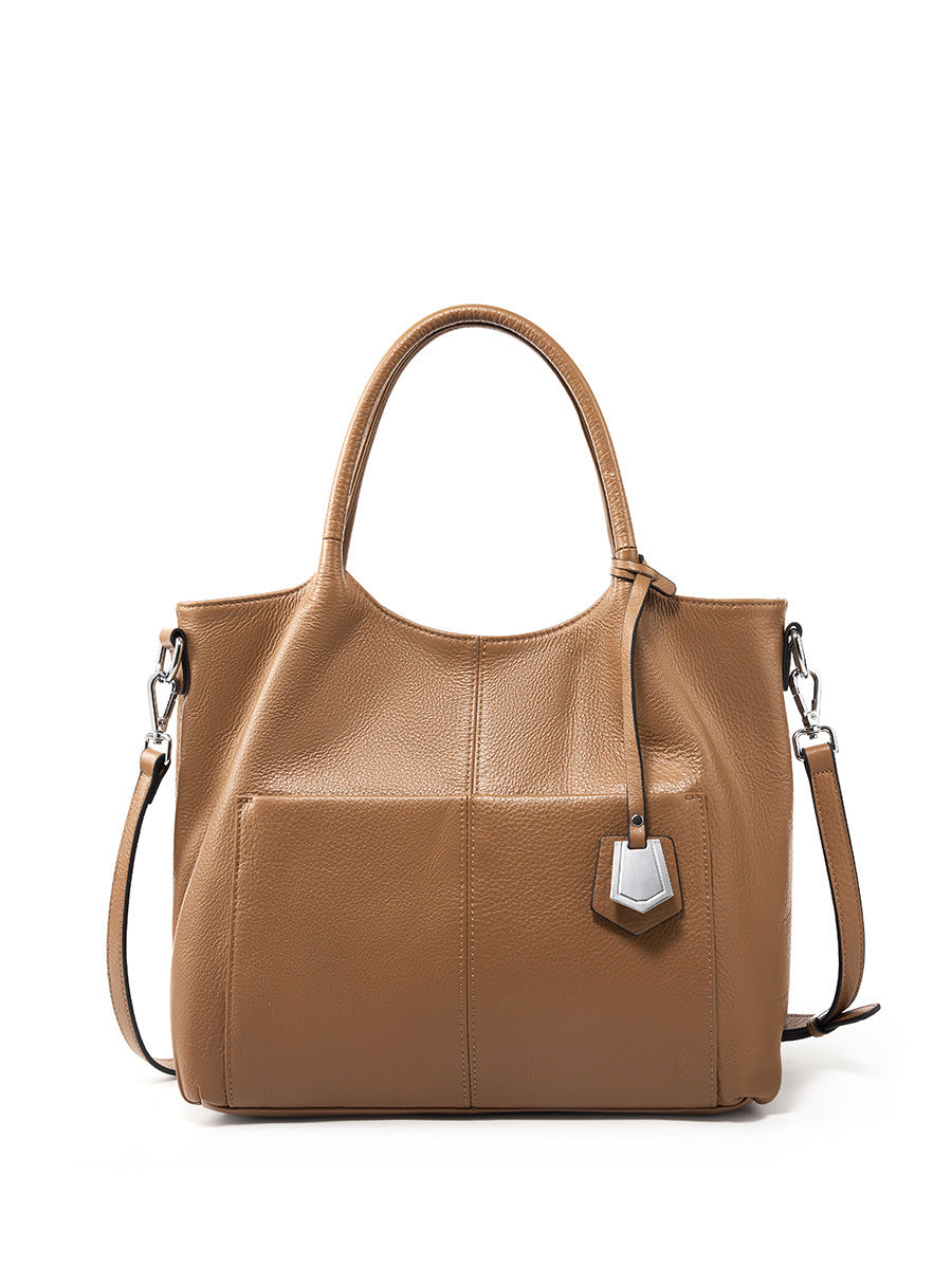 Malas de pele genuína para mulheres, novas malas de ombro simples para primavera/verão 2026, malas tote de grande capacidade feminina, malas para mães de meia-idade, malas crossbody