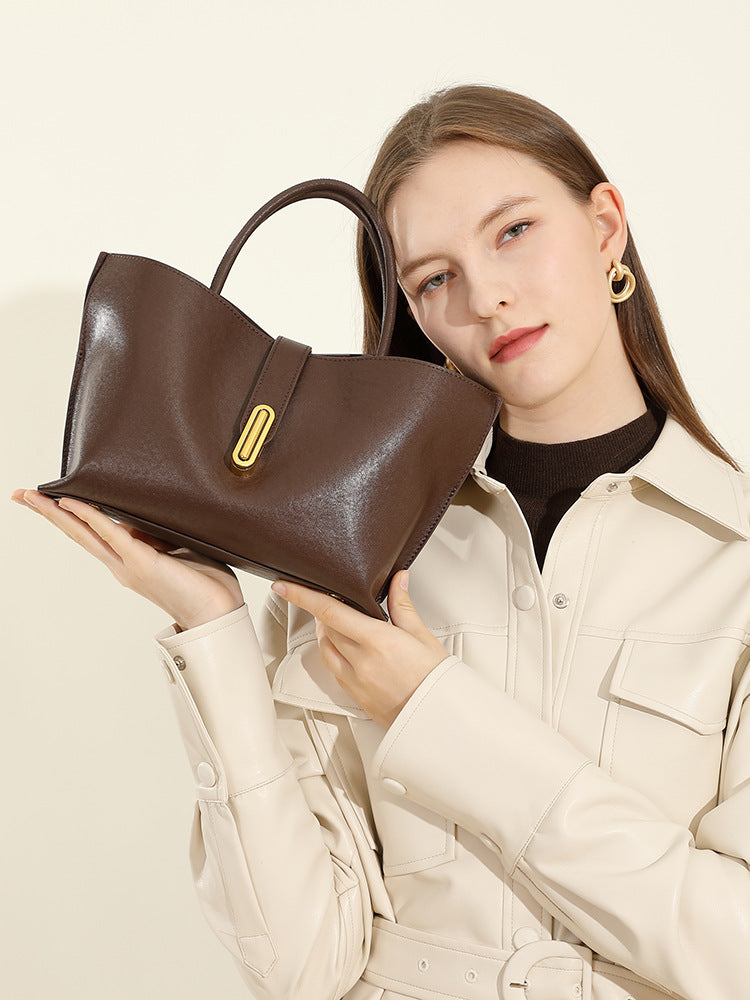 Malas femininas transfronteiriças, nova mala tote de vaca curtida vegetal topo de grão, mala de moda de nicho para pendulares, mala cruzada feminina