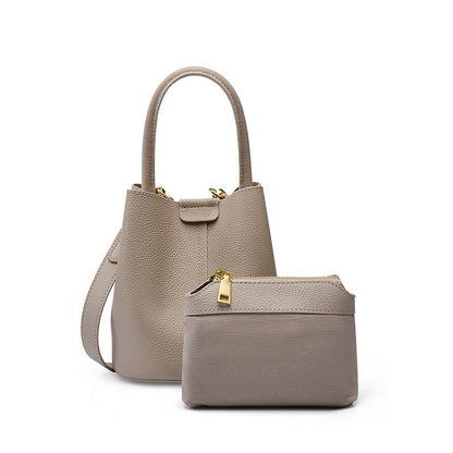 Bolsas de vaca de topo de grão 2026 Novas malas femininas, bandoleiras, malas de nicho de verão em pele genuina de alta qualidade, sacos bucket