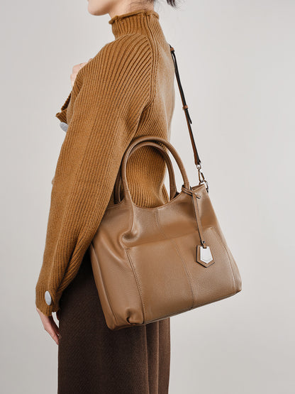 Malas de pele genuína para mulheres, novas malas de ombro simples para primavera/verão 2026, malas tote de grande capacidade feminina, malas para mães de meia-idade, malas crossbody