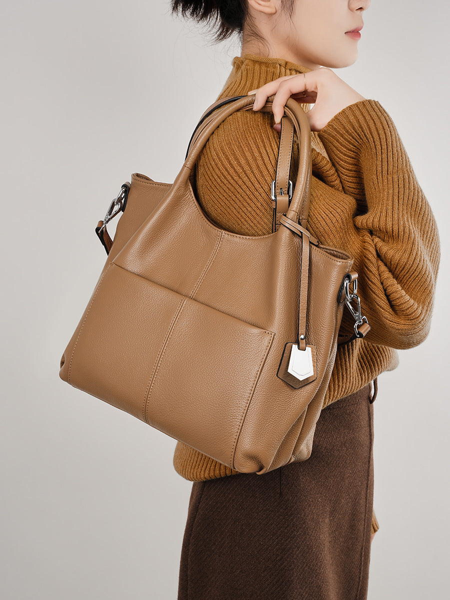 Malas de pele genuína para mulheres, novas malas de ombro simples para primavera/verão 2026, malas tote de grande capacidade feminina, malas para mães de meia-idade, malas crossbody