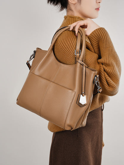 Malas de pele genuína para mulheres, novas malas de ombro simples para primavera/verão 2026, malas tote de grande capacidade feminina, malas para mães de meia-idade, malas crossbody