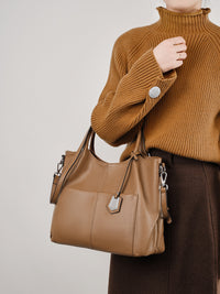 Malas de pele genuína para mulheres, novas malas de ombro simples para primavera/verão 2026, malas tote de grande capacidade feminina, malas para mães de meia-idade, malas crossbody